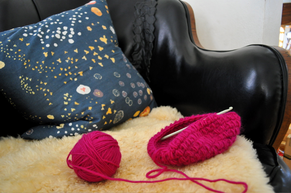 crocheting on the comfy chair
