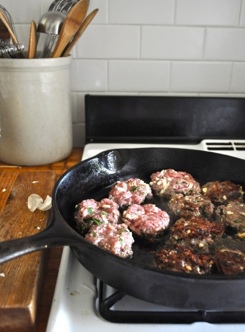 frying the lamb burgers